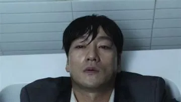 What is sang-woo burning in the bathroom?